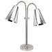 A silver Eastern Tabletop double arm freestanding heat lamp with cone shades and flex necks.