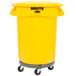 A yellow Rubbermaid trash can on wheels with a lid.