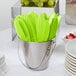 A bucket of green knives.