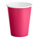 A hot magenta pink paper cup with a white rim.