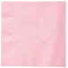 A pink napkin with a white border.