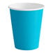 A turquoise blue paper cup with a white rim.