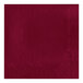 A red luncheon napkin with a square border.