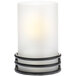 A white candle holder with black wire around it on a black stand.