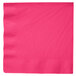 A hot magenta pink paper dinner napkin with a white background.