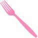 A close-up of a Creative Converting candy pink heavy weight plastic fork.