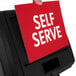 A hand holding a Commercial Zone Vue-T-Ful Isle self-serve sign.