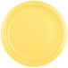 A close-up of a Creative Converting Mimosa Yellow paper plate.