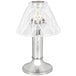 A Sterno Paige chrome table lamp with a clear glass shade.