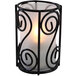 A Sterno swirl frost lamp candle holder with a lit candle.