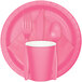 A pink paper plate with a black border.