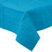 A turquoise blue tablecloth with a pattern on it.
