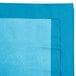 A turquoise blue table cover with a white background.