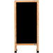 A black porcelain marker board with a solid oak wood A-frame.