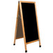 A black porcelain marker board with a solid oak wood A-frame.