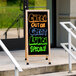 A white Aarco A-frame sidewalk sign with a white marker board.