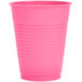 A Creative Converting candy pink plastic cup.