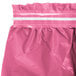 A pink plastic table skirt with a white stripe.