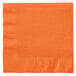 A close-up of a Creative Converting Sunkissed Orange 1/4 Fold Luncheon Napkin with a folded edge.