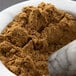 Ground cumin in a mortar and pestle.