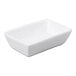 A small, rectangular, ultra bright white porcelain sauce bowl.