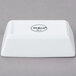 A white rectangular Libbey porcelain sauce bowl with black text.