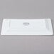 A white rectangular Libbey porcelain plate with a logo on it.