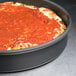 An American Metalcraft hard coat anodized aluminum pan with a pizza in it.