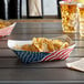 A patriotic paper food tray with an American flag design.