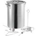 A Backyard Pro stainless steel stock pot with a lid and accessories, including a thermometer and metal spoon.