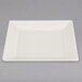 a white plate with a fork