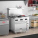 A commercial stainless steel Vulcan 36-inch liquid propane range with six burners and a standard oven base.