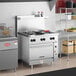 A commercial stainless steel 6-burner liquid propane range with a convection oven base.