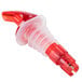 A Tablecraft red plastic liquor pourer with a clear spout.