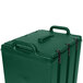 A Kentucky green plastic Camtainer lid with black handles and a vent.