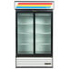 A white True glass door refrigerator with LED lighting.
