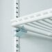 A white metal shelf with a clip.