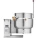 A Vulcan 12 gallon tilting steam jacketed kettle with a metal lid and handle.