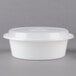 A white Pactiv plastic container with a lid.