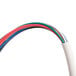 A close-up of the white and red wires on a Dema V-Line OPL Laundry Chemical Dispenser Pump System.