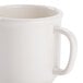 A white GET Diamond Ivory plastic mug with a handle.