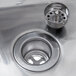 A Regency stainless steel wall mounted hand sink with a drain and a P-trap.