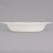 A Fineline Heritage white plastic bowl with gold trim.