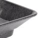 A black rectangular polyethylene deli server with a handle.