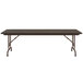 A walnut Correll folding table with a metal frame.