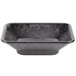 A black rectangular polyethylene condiment server with a gray rim.