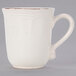 A white stoneware coffee mug with a brown rim and handle.