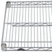A Metro Super Erecta stainless steel wire shelf with two handles.