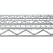 A Metro Super Erecta stainless steel wire shelf with a grid pattern.