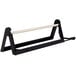 A black metal Bulman paper dispenser with a white edge blade on a black and white metal stand.